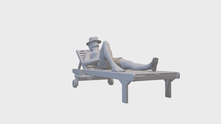 Man on a sun lounger sunbathing miniature figure 